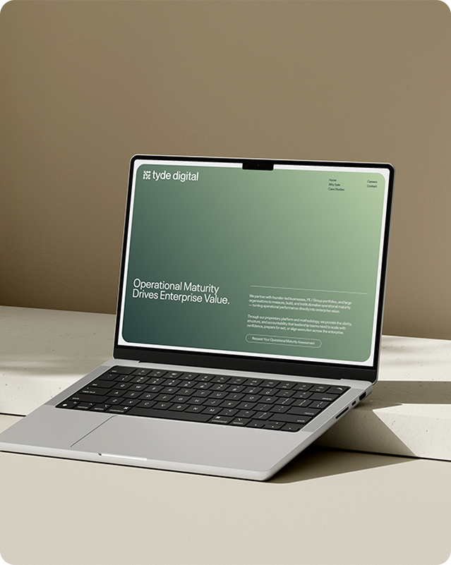 Laptop mockup on a plinth displaying the Tyde Digital homepage with a green gradient hero